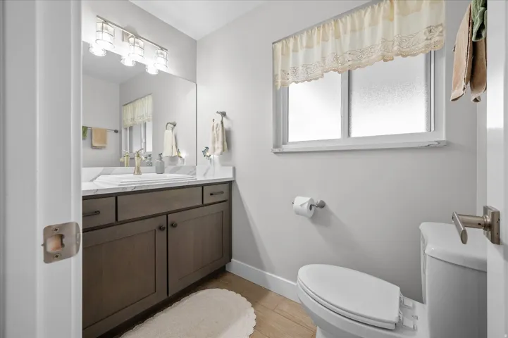 Bathroom with vanity and light wood-style floors