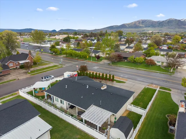 Aerial perspective of suburban area with a mountainous background