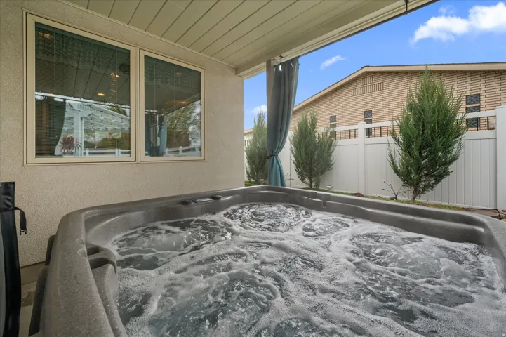 View of patio featuring a hot tub