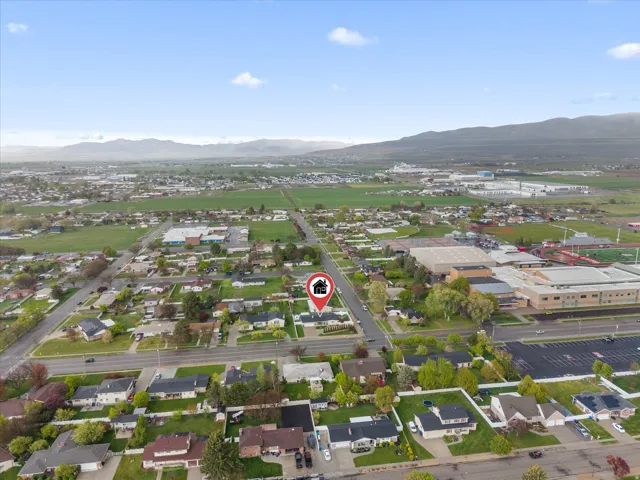 Aerial perspective of suburban area with a mountain backdrop
