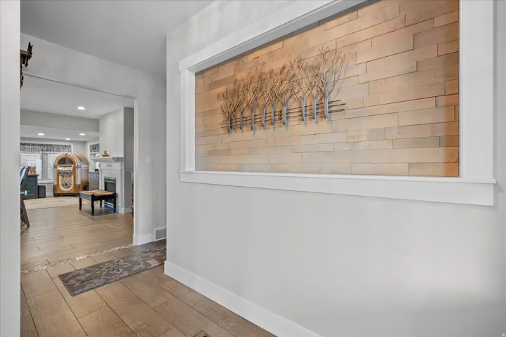 Hallway featuring wood finished floors and recessed lighting