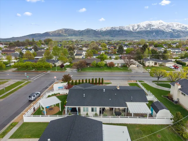 Aerial perspective of suburban area with a mountainous background