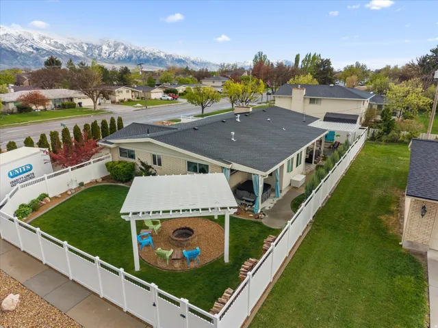 Aerial perspective of suburban area with a mountainous background
