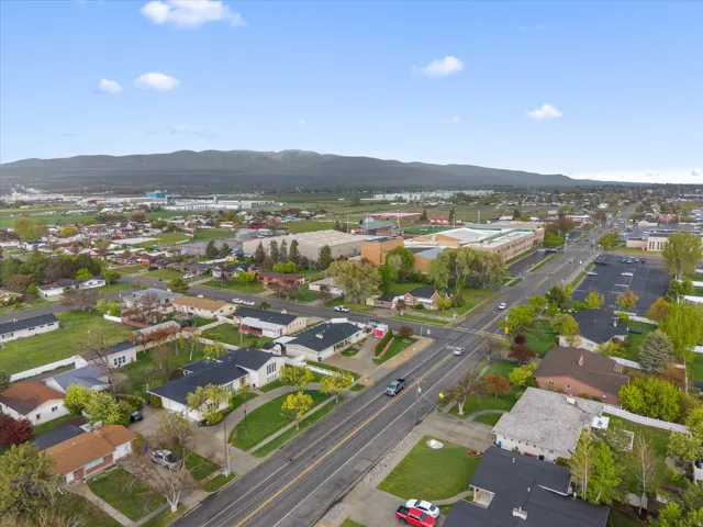 View of property location featuring mountains and nearby suburban area