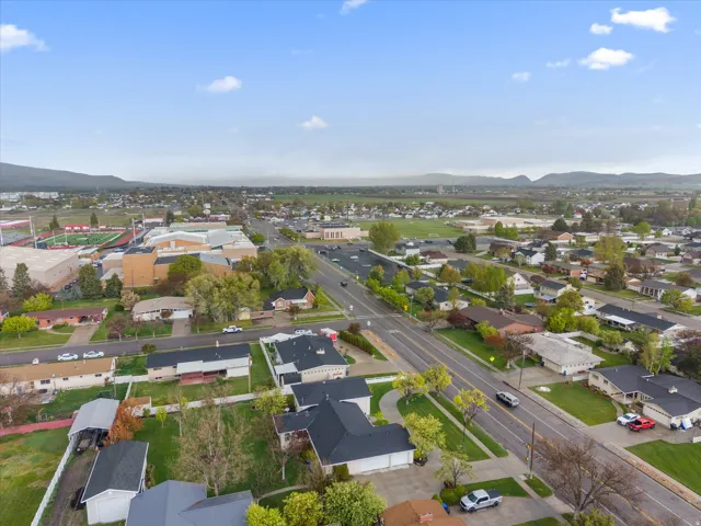 Aerial perspective of suburban area featuring a mountainous background