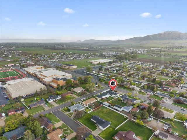 Aerial perspective of suburban area with a mountainous background