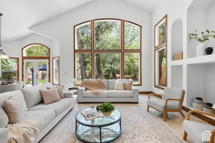 Vaulted ceilings and expansive picture windows with wood trim