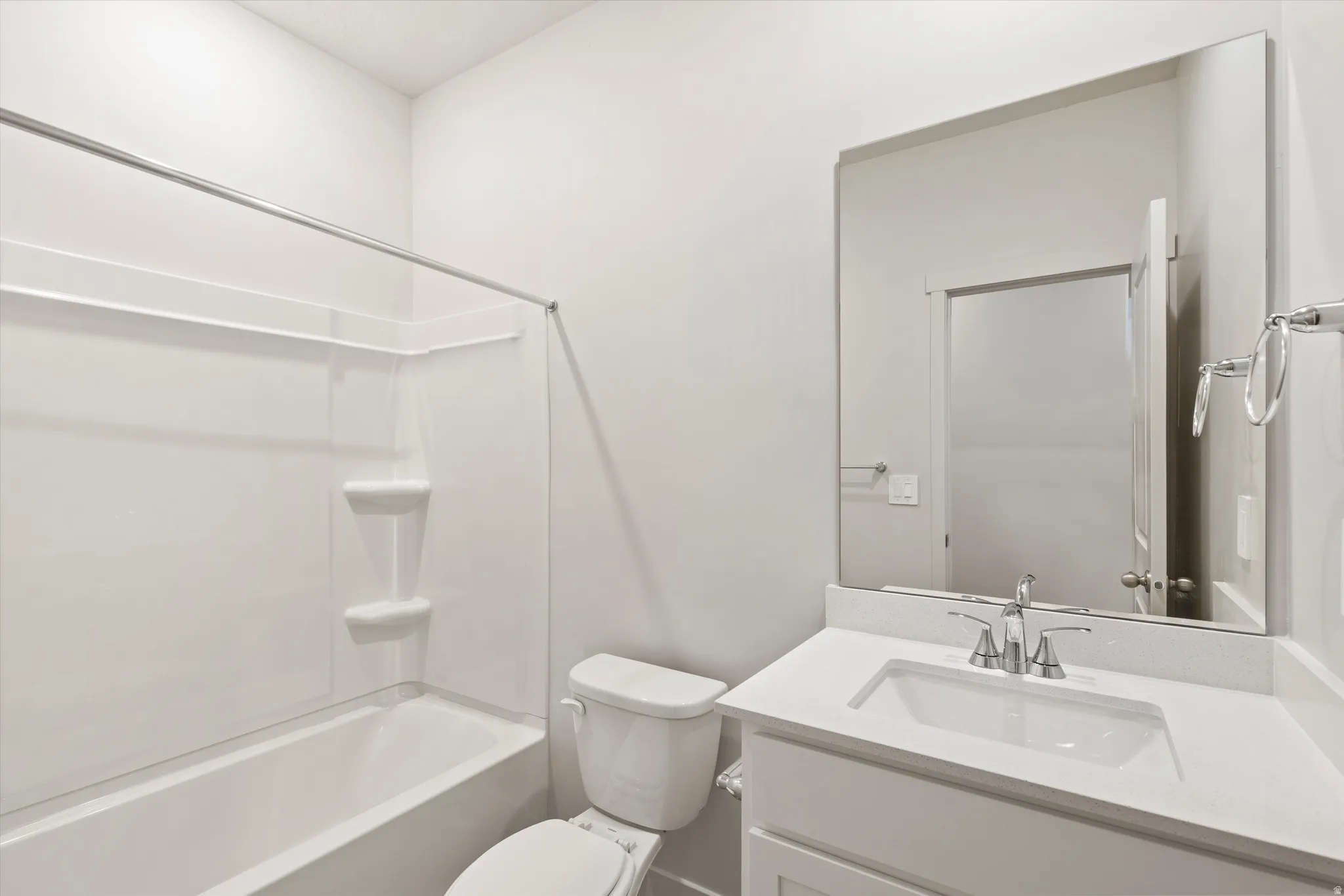 Full bath featuring vanity and shower / washtub combination