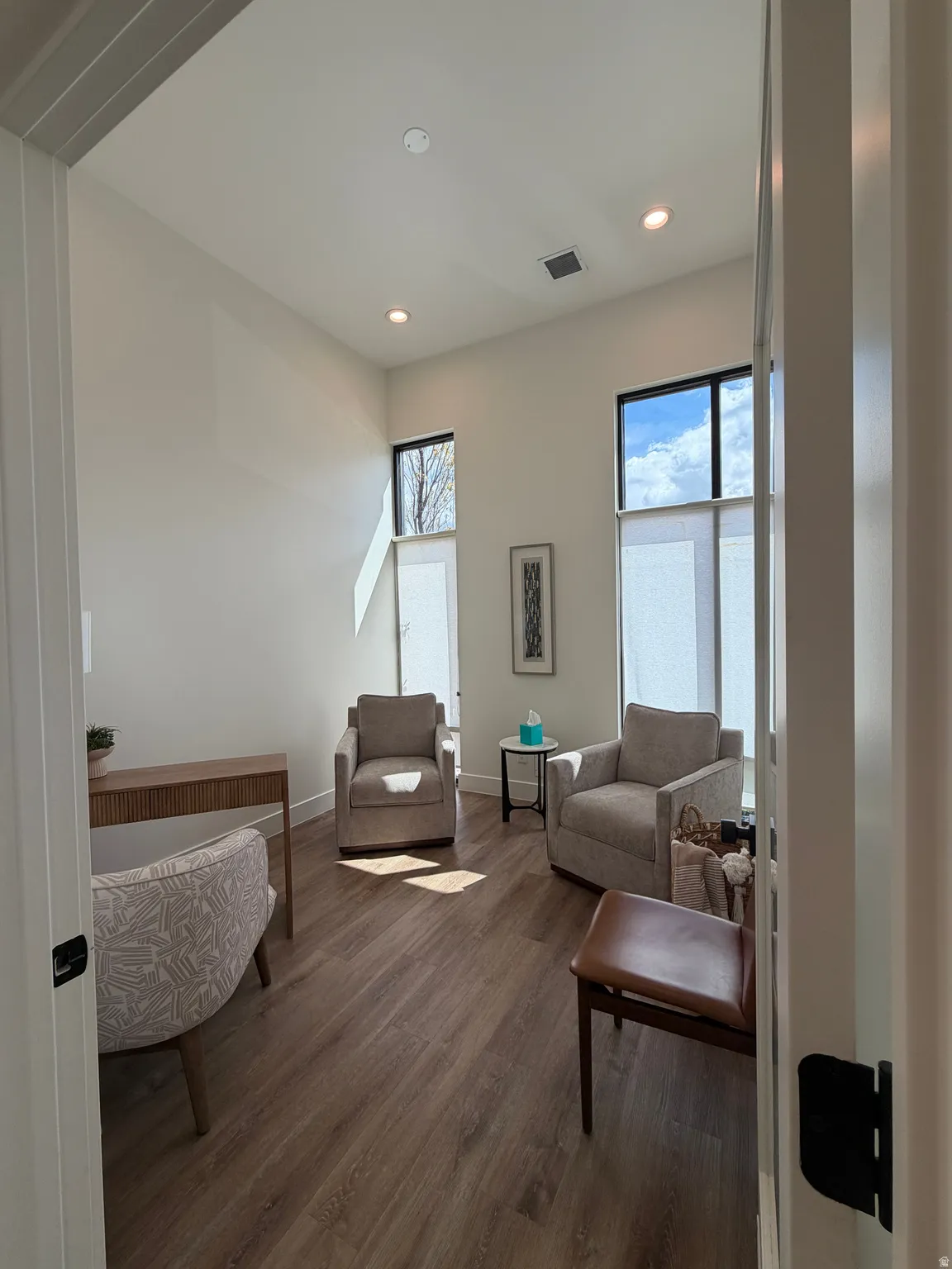 Office area with large windows and natural light