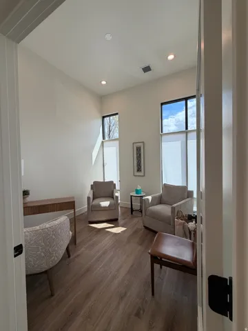 Office area with large windows and natural light