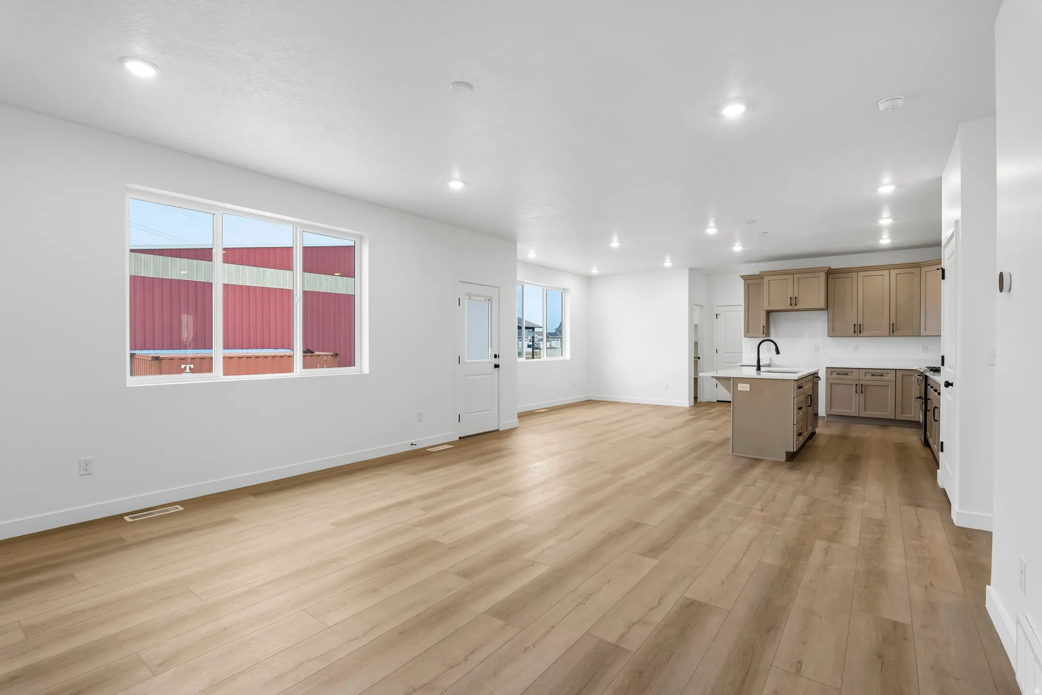 Unfurnished living room featuring light wood finished floors and recessed lighting