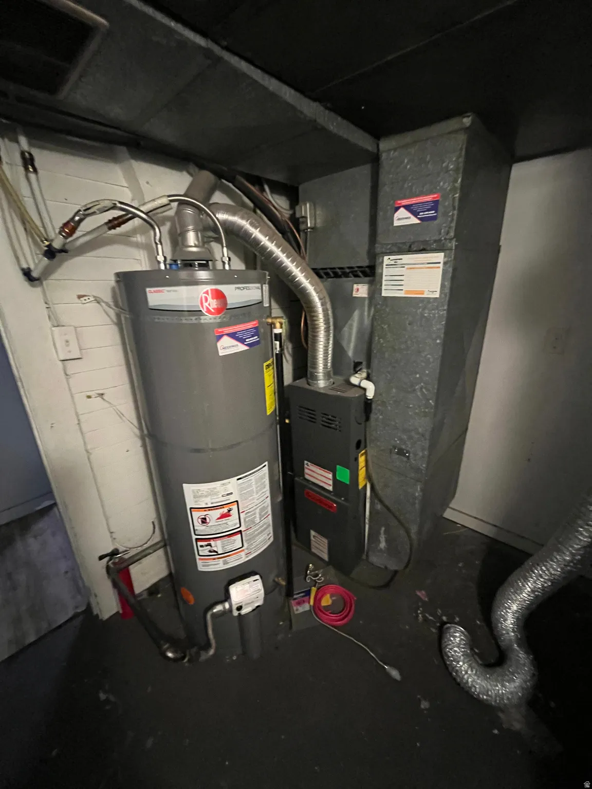 Utilities featuring heating unit and water heater