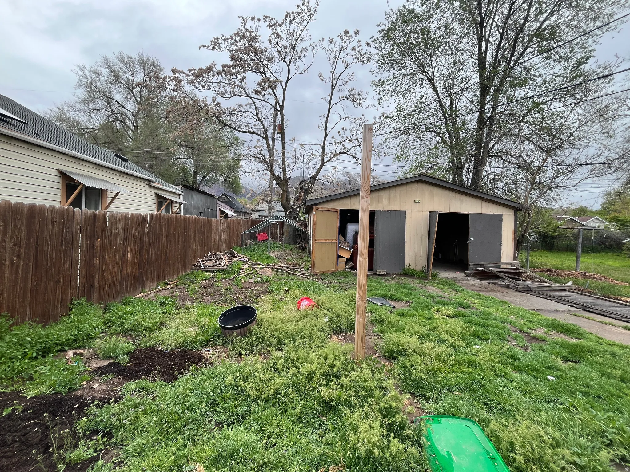Fenced yard with an outdoor structure