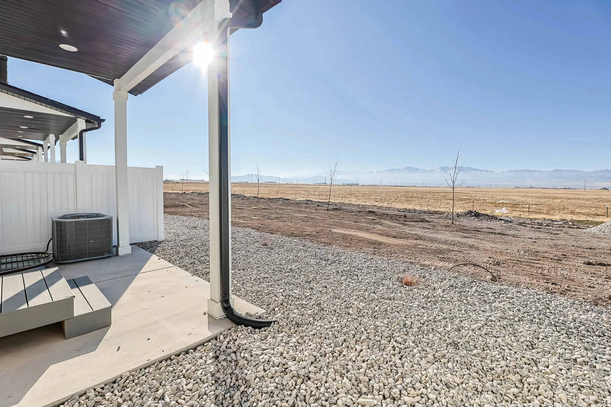 View of yard featuring a patio, a view of rural / pastoral area, and a mountain view
