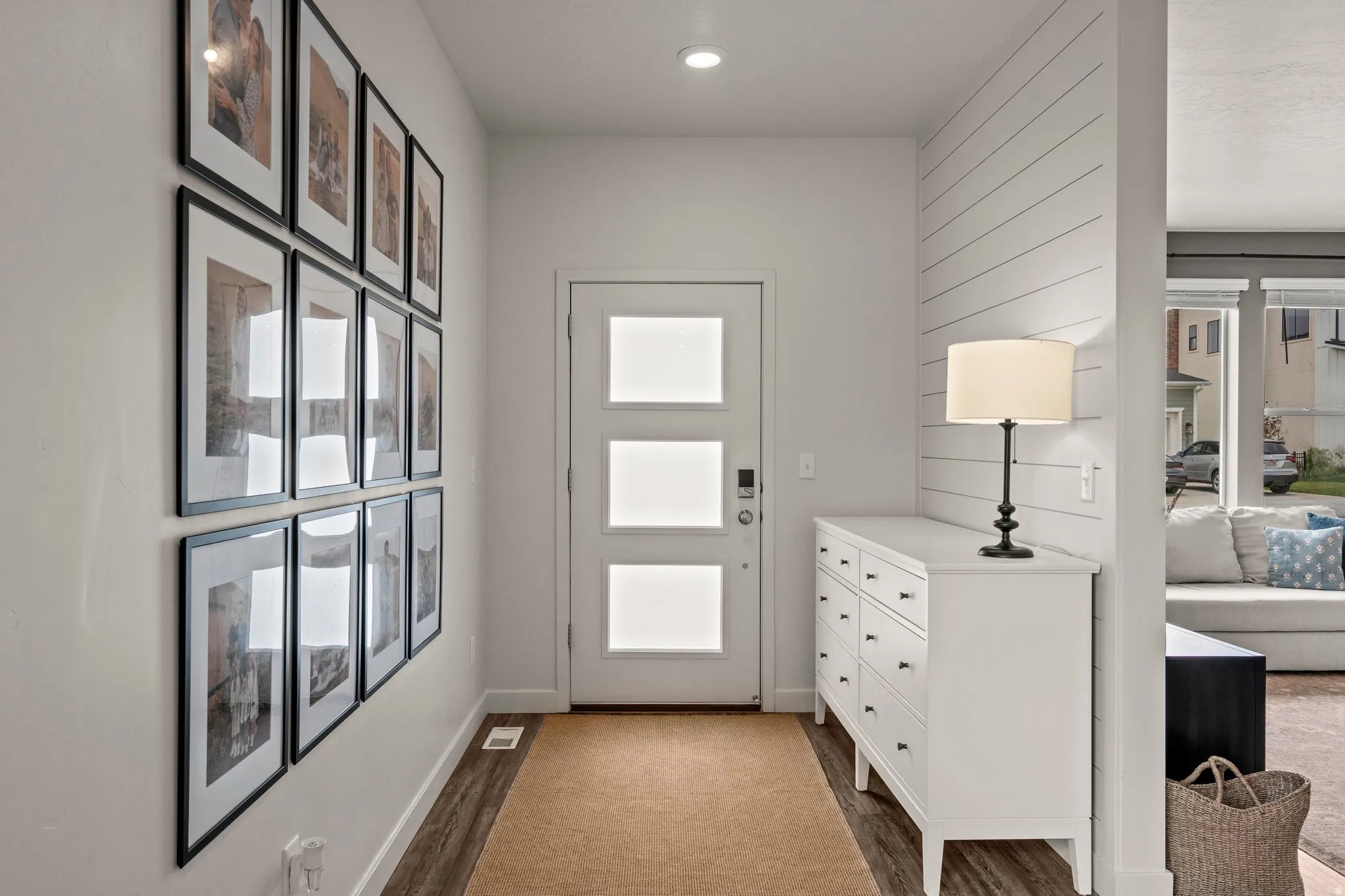 Entryway with dark wood-style floors and recessed lighting