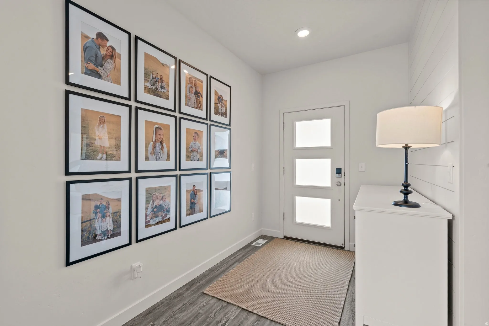 Doorway to outside featuring wood finished floors and recessed lighting