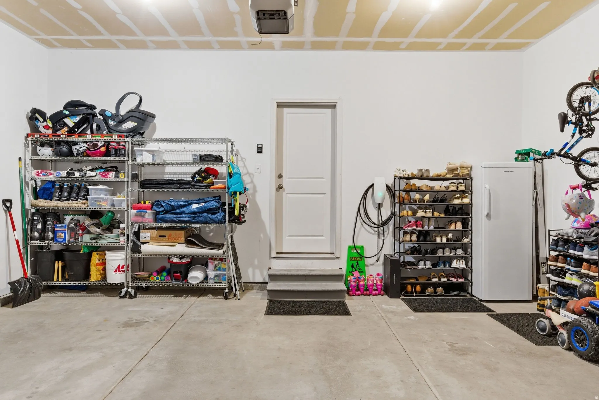 Garage with car charger and a garage door opener