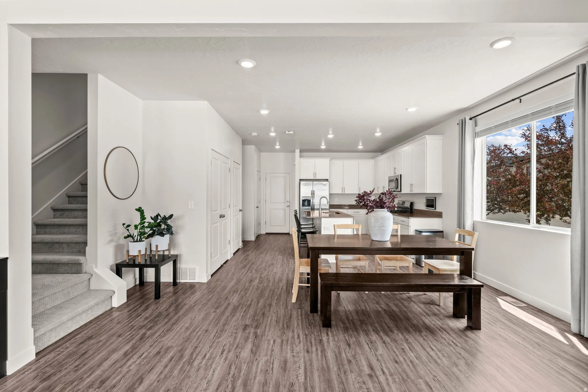 Dining room featuring dark wood finished floors and recessed lighting