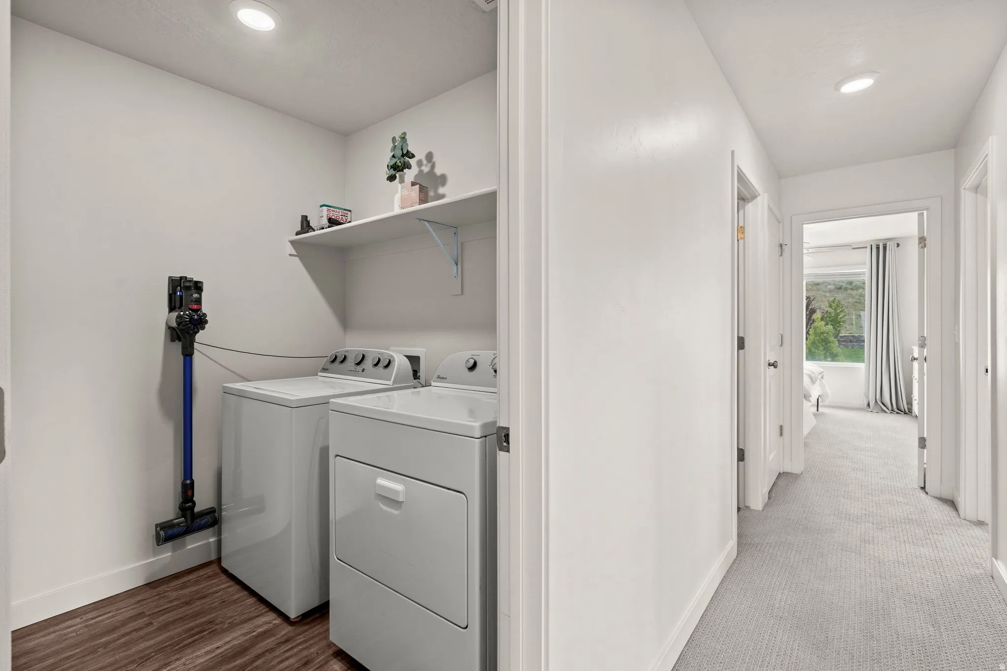 Laundry area with washer and clothes dryer and recessed lighting