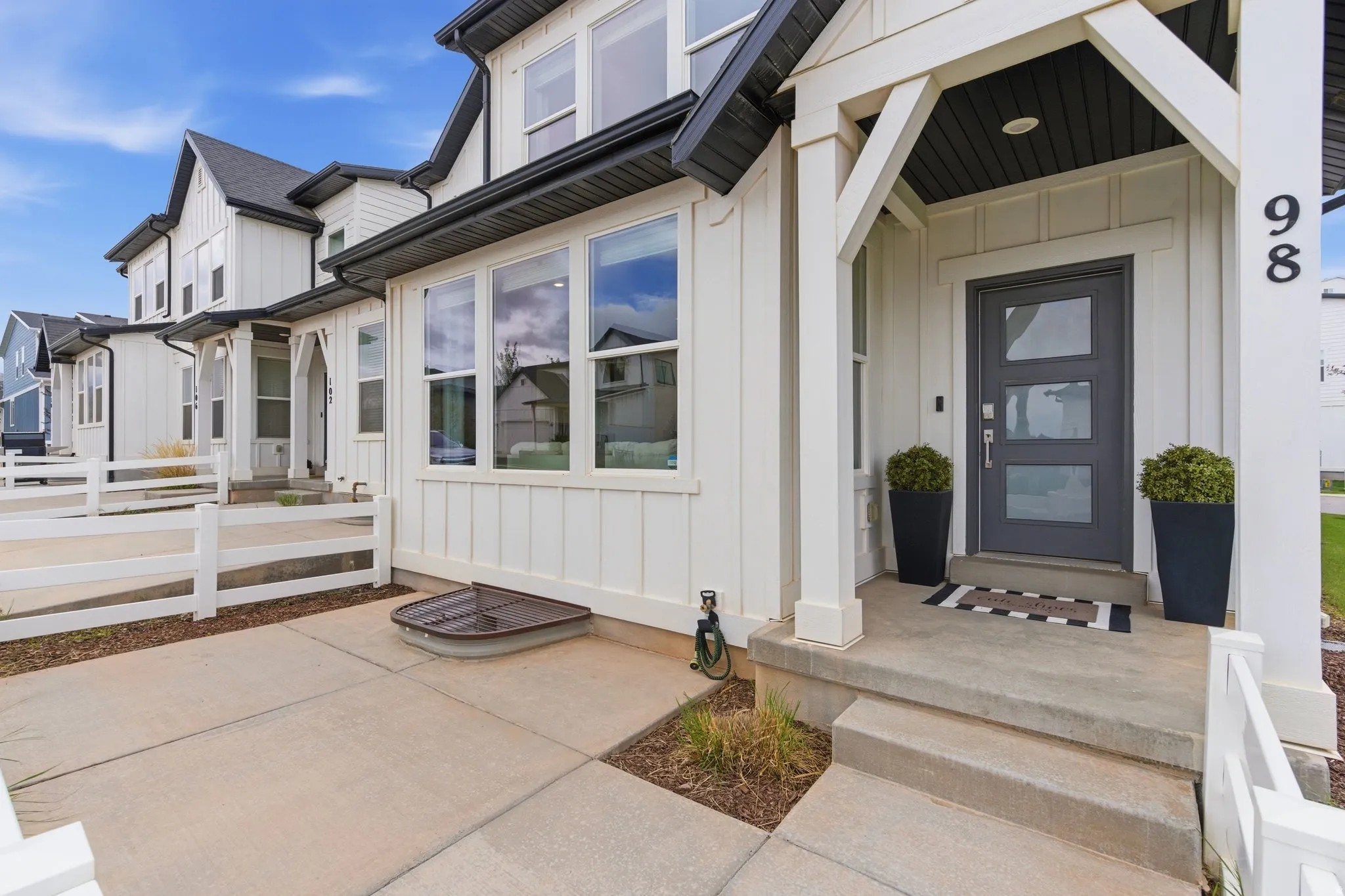 Property entrance featuring board and batten siding