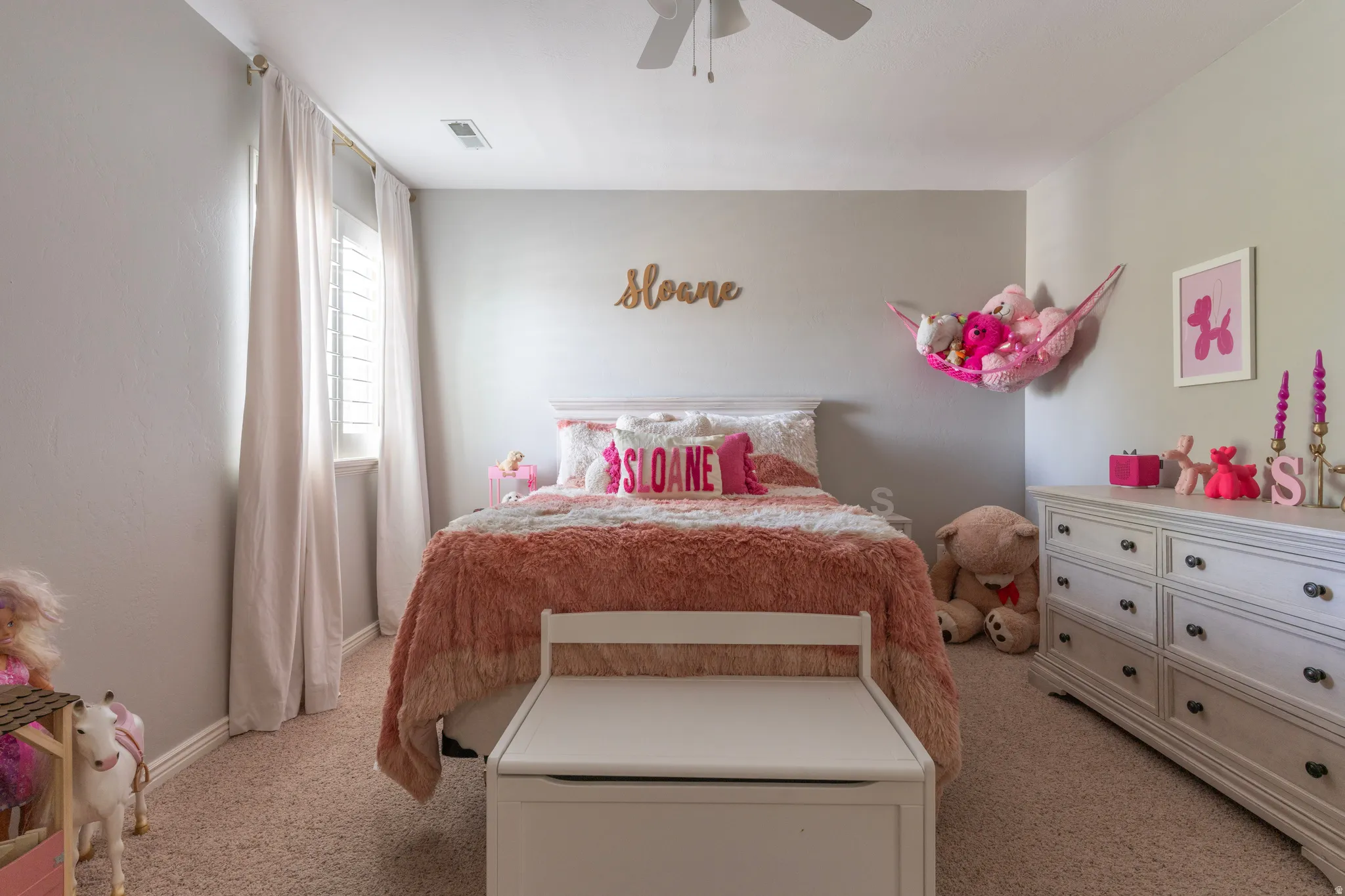 Bedroom with light carpet and ceiling fan