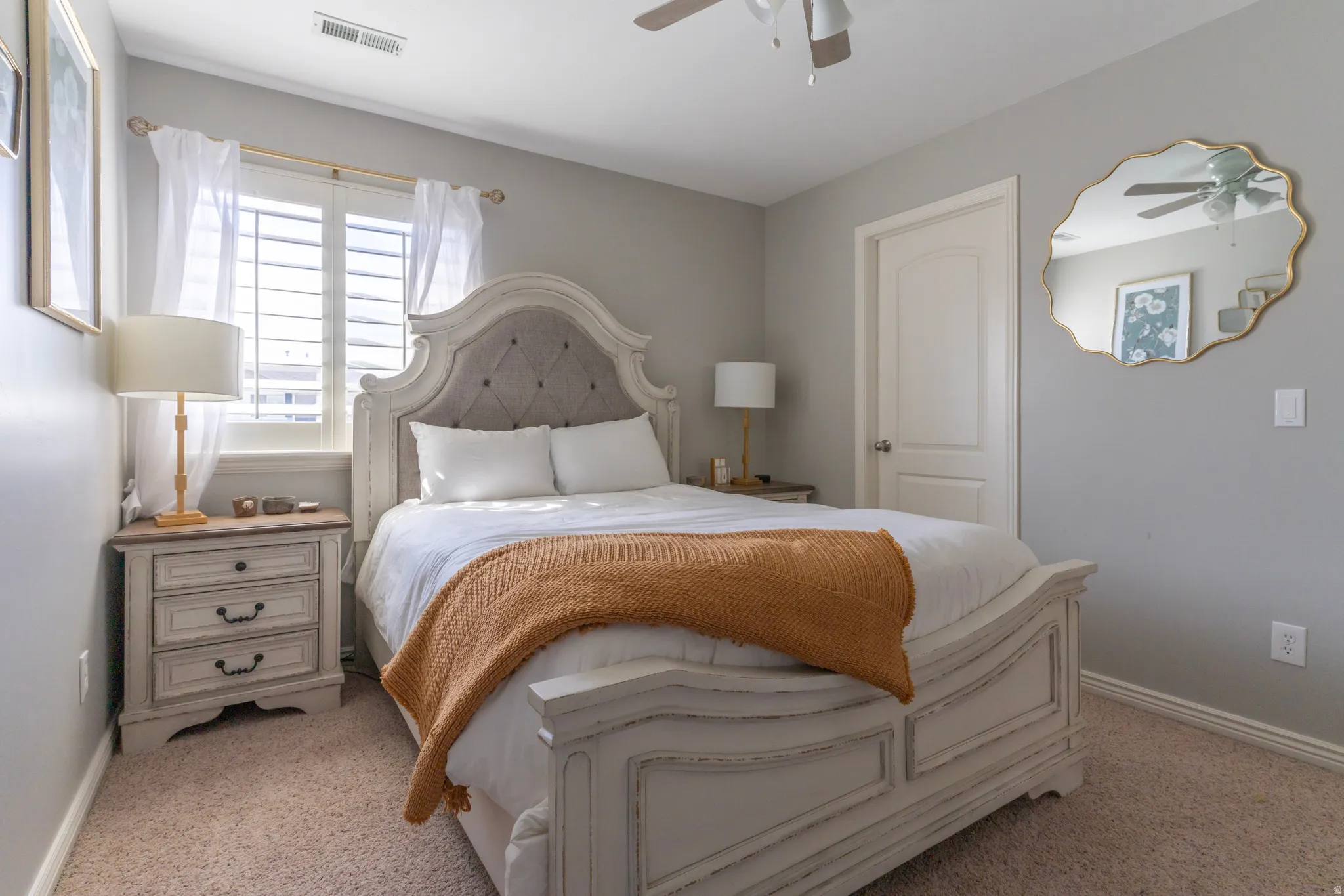 Bedroom featuring baseboards and light carpet