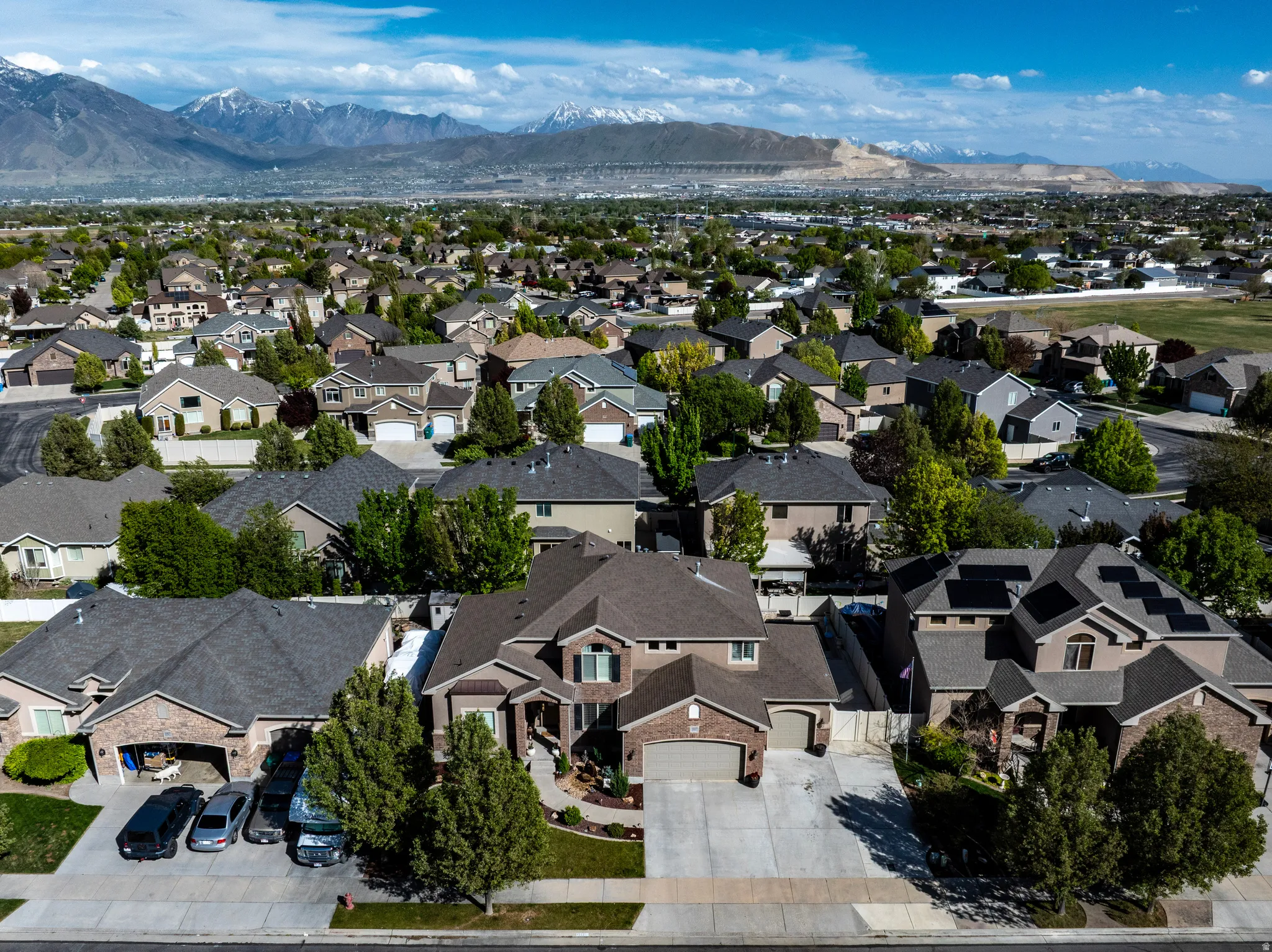 Aerial view of residential area featuring a mountainous background