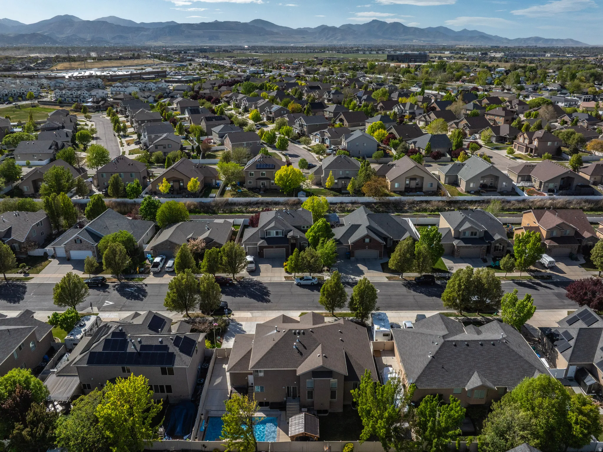 Aerial view of residential area featuring a mountainous background