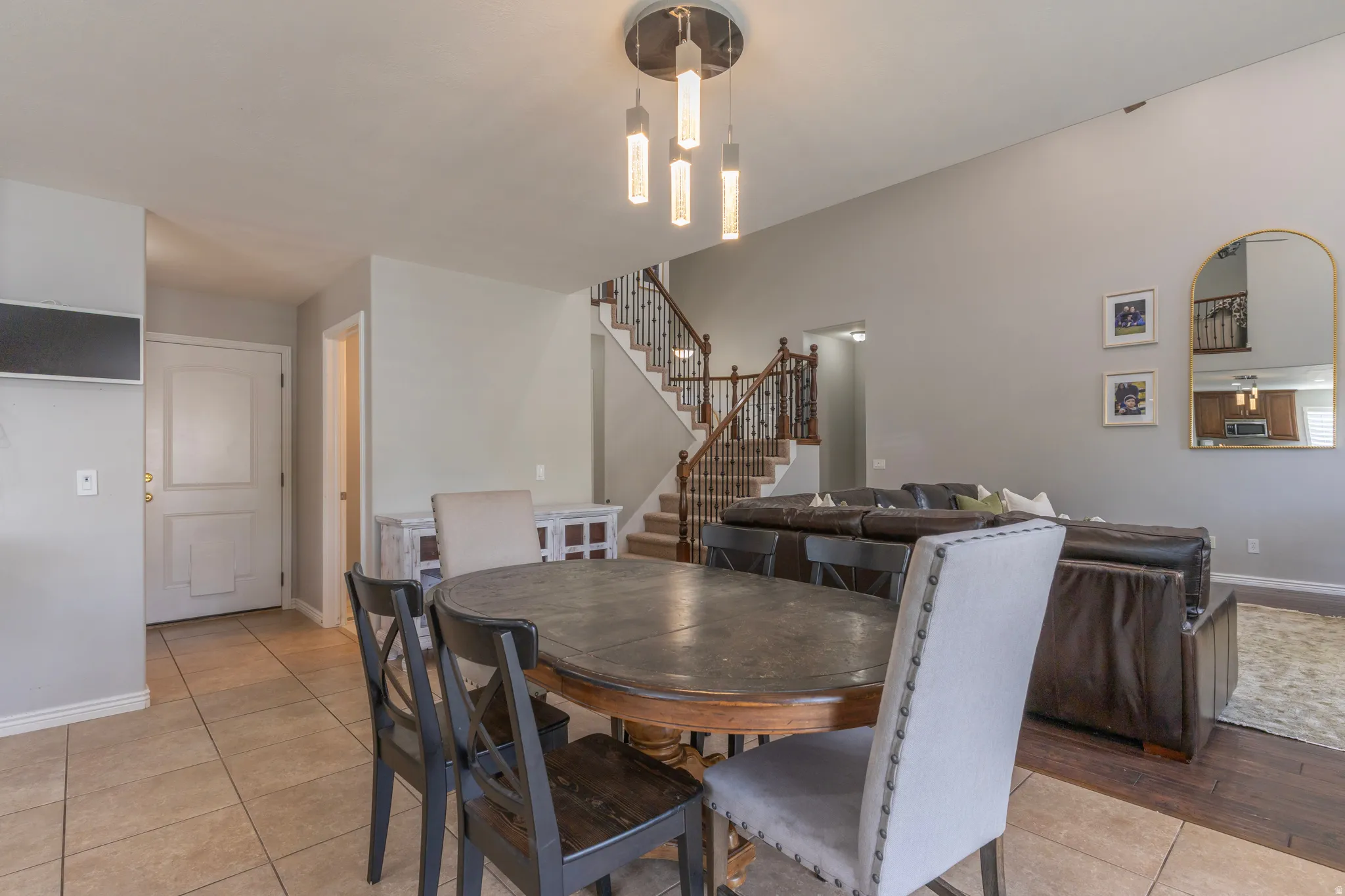 Dining area featuring stairs and light tile patterned flooring