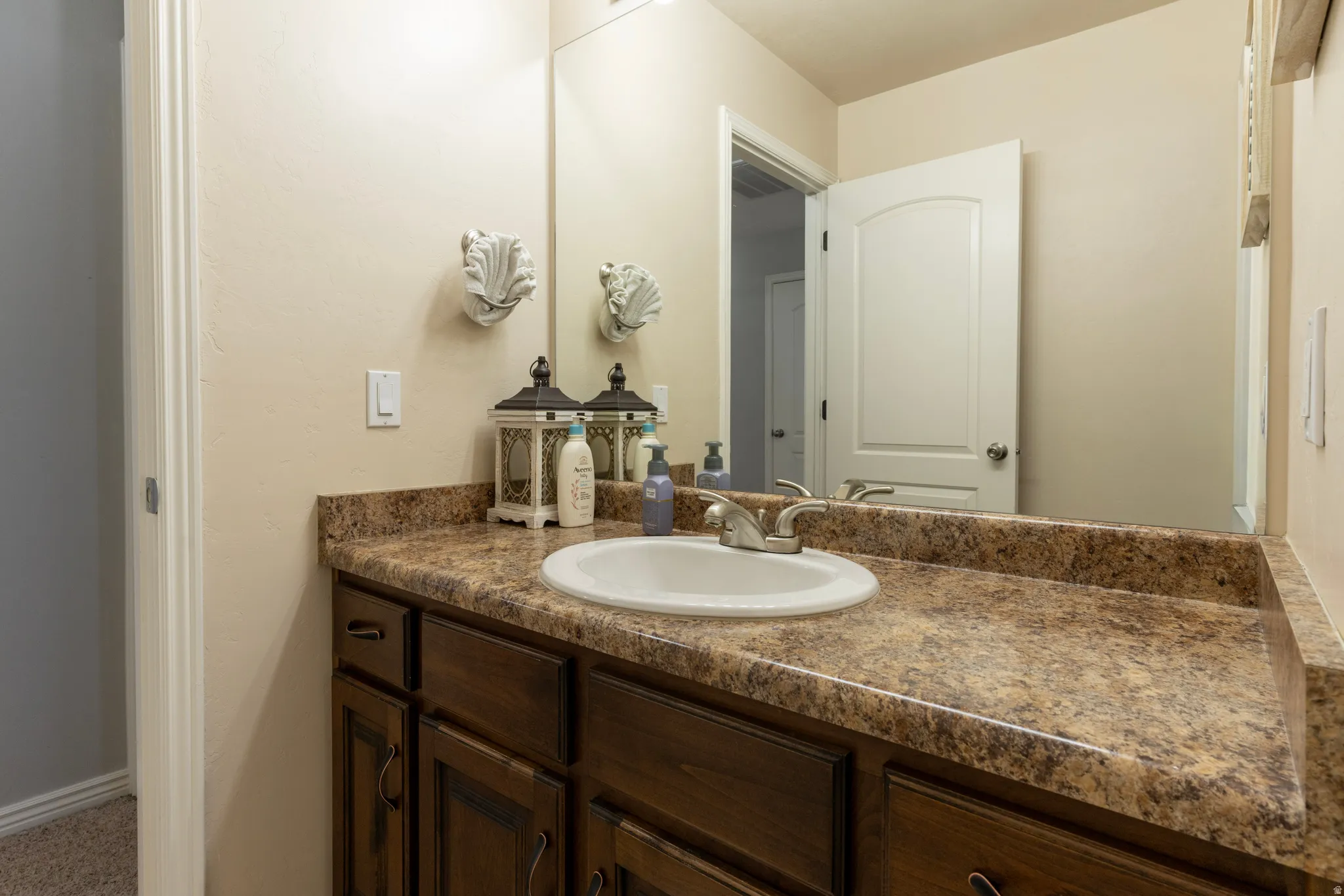 Bathroom with vanity and baseboards