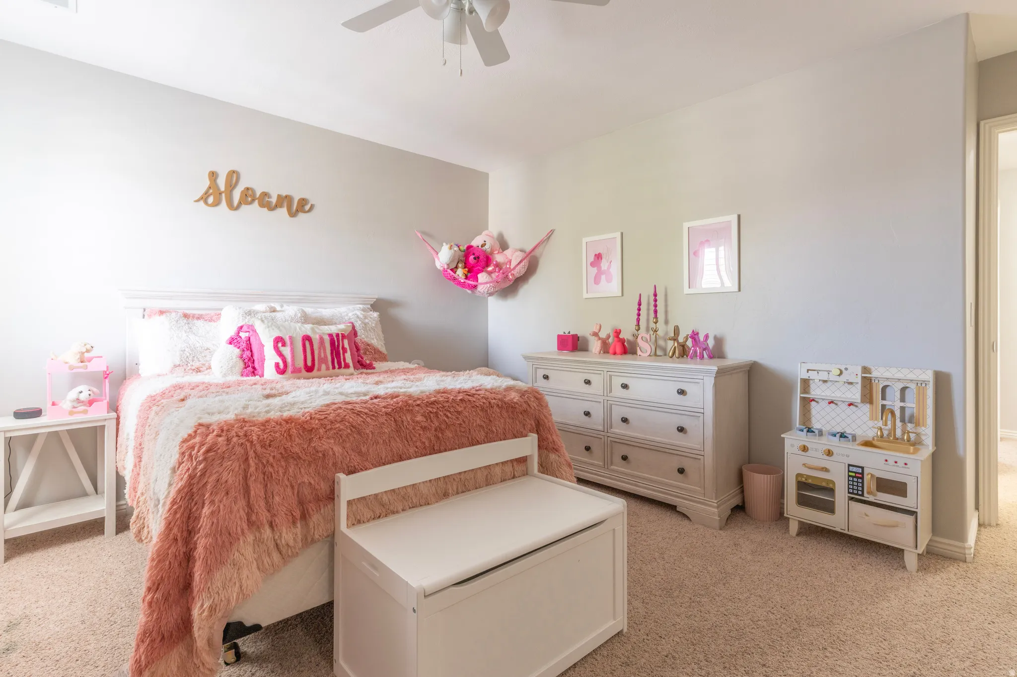 Bedroom with light colored carpet and ceiling fan