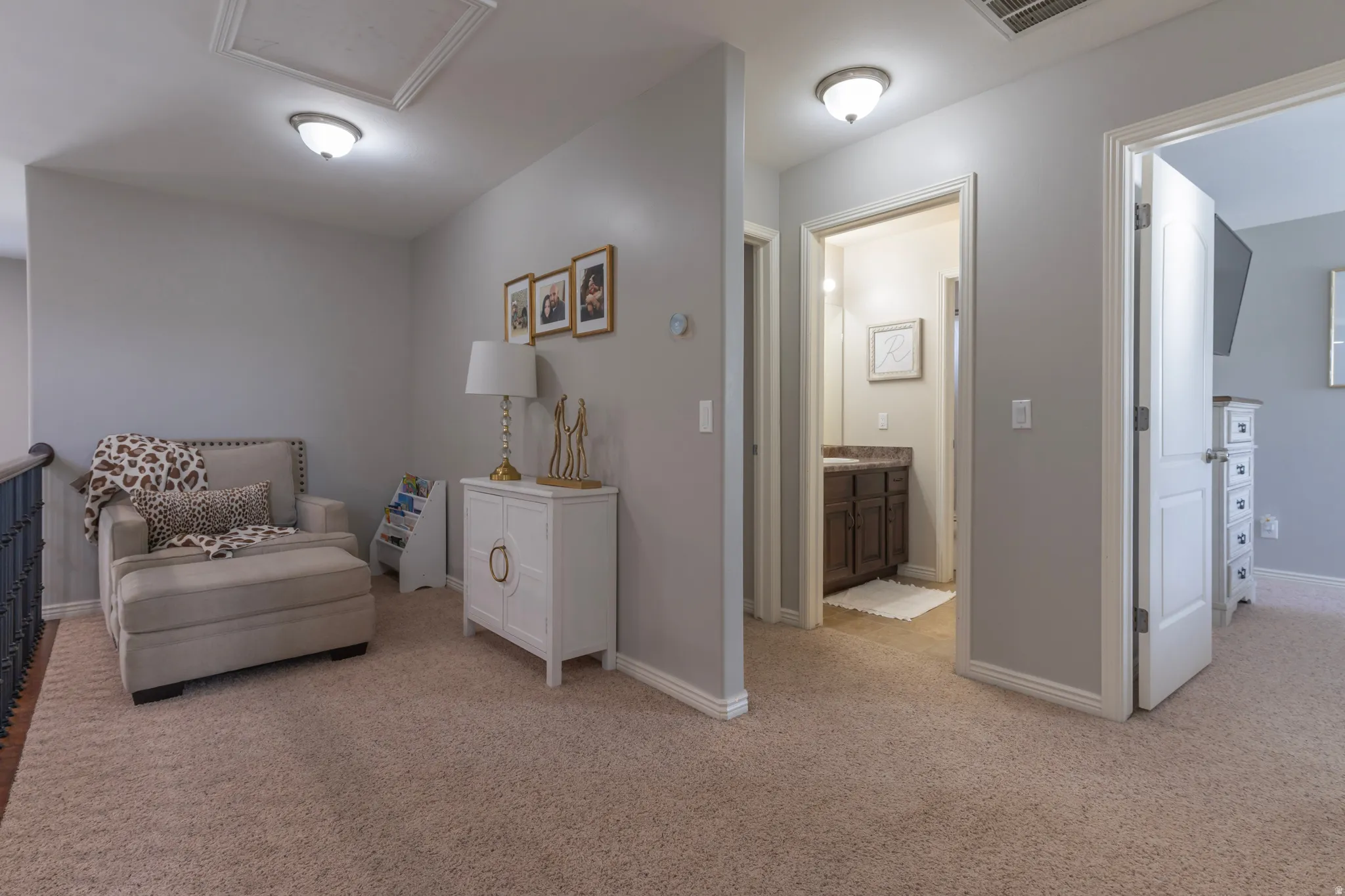 Living area with light carpet
