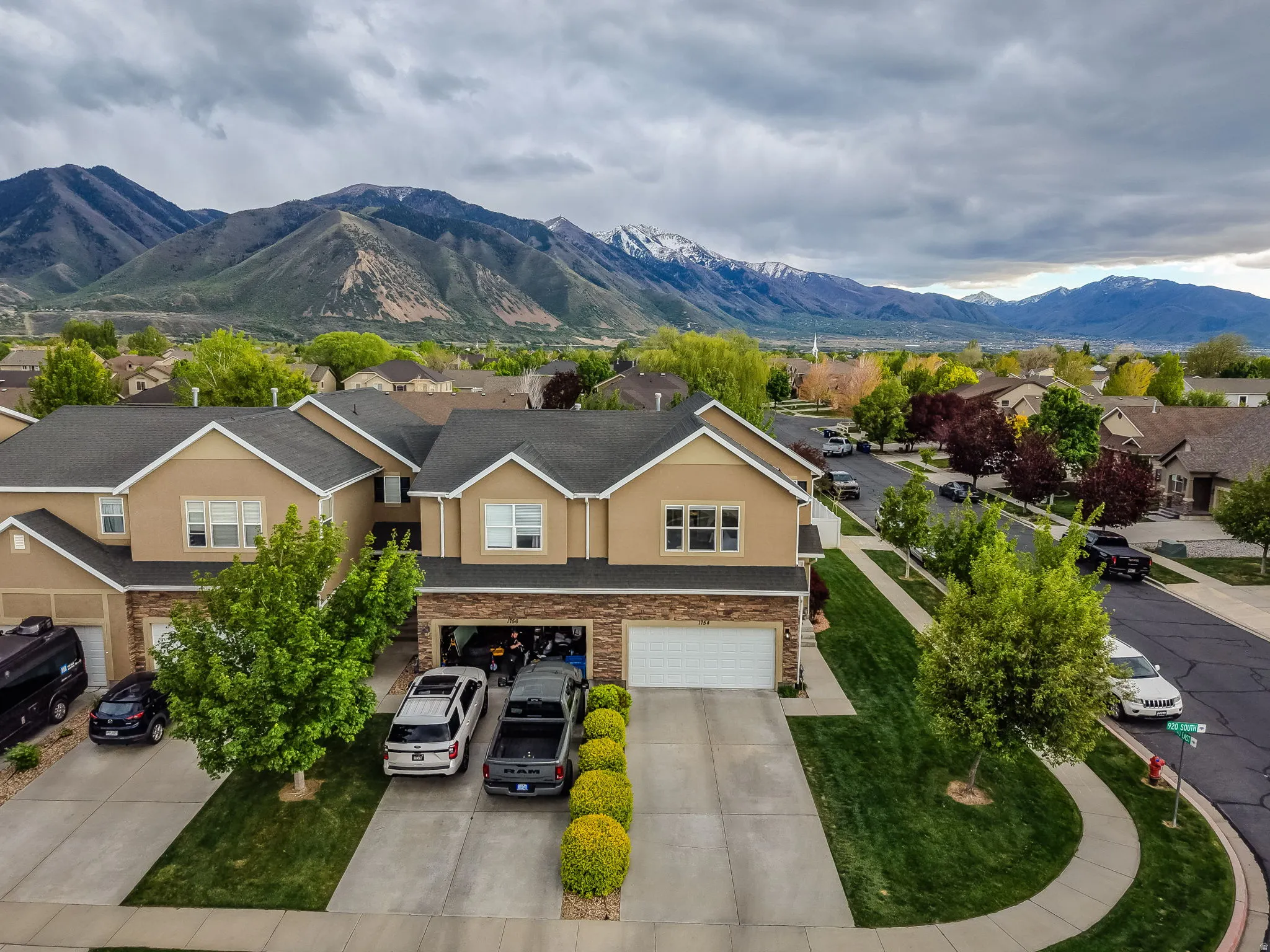 Aerial perspective of suburban area featuring a mountainous background