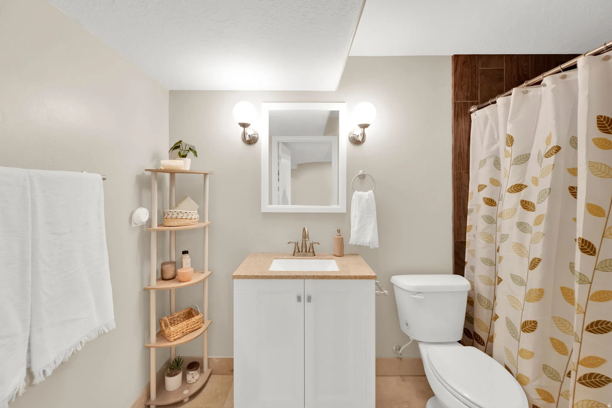 Bathroom with vanity and a shower with curtain