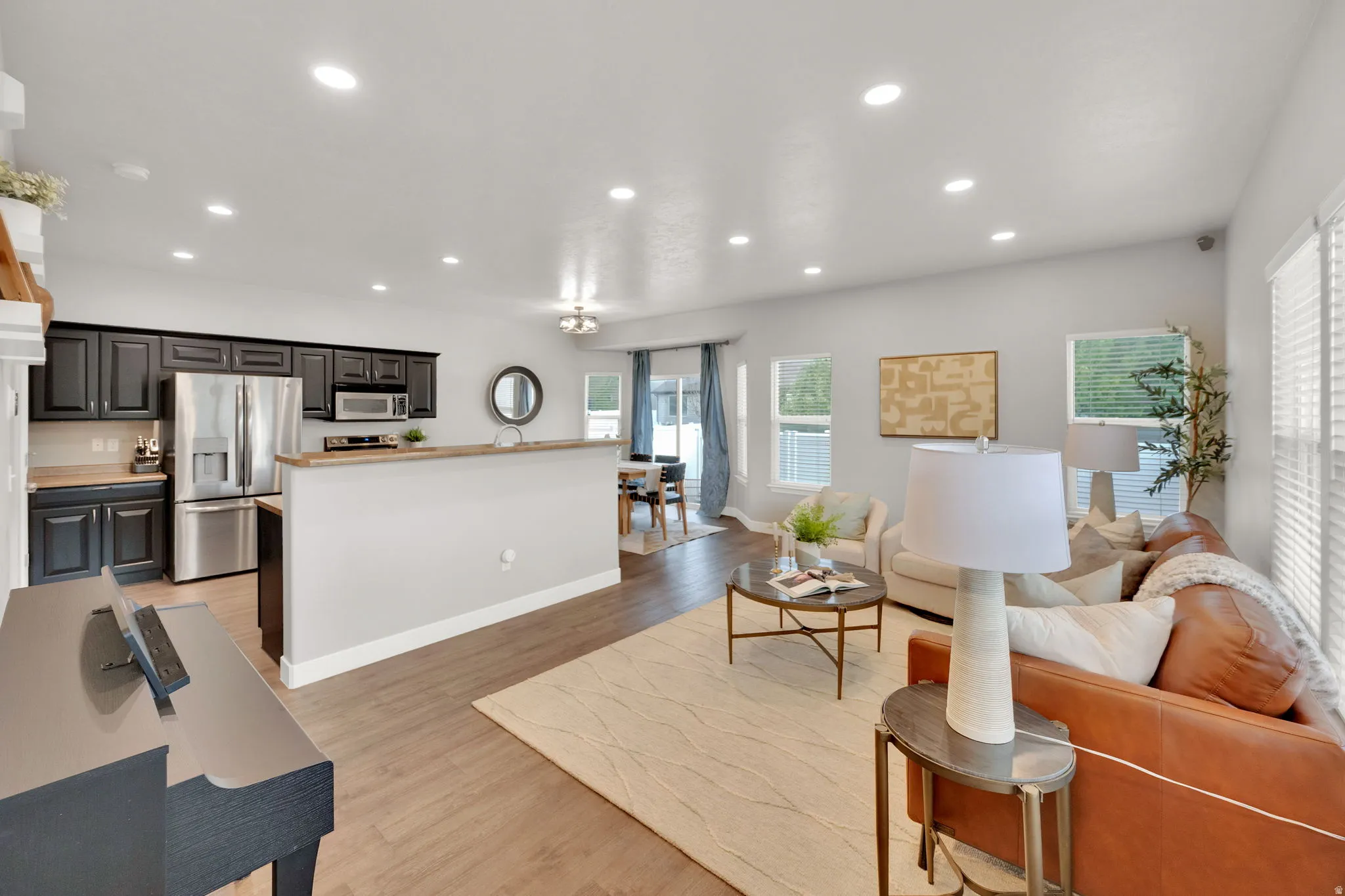 Living area featuring recessed lighting and light wood-style floors