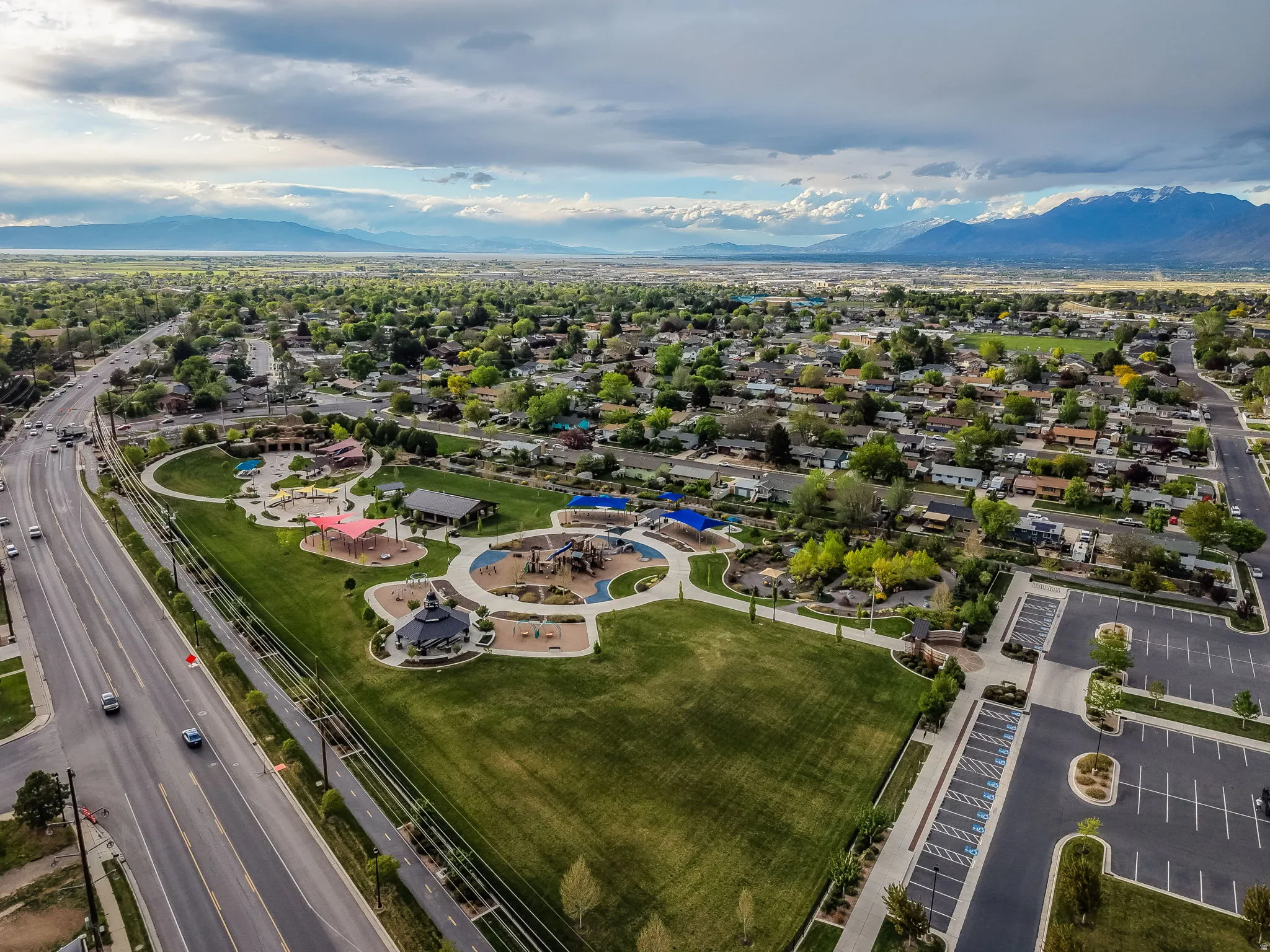 Aerial view of property's location featuring mountains and All Abilities Park a few blocks away