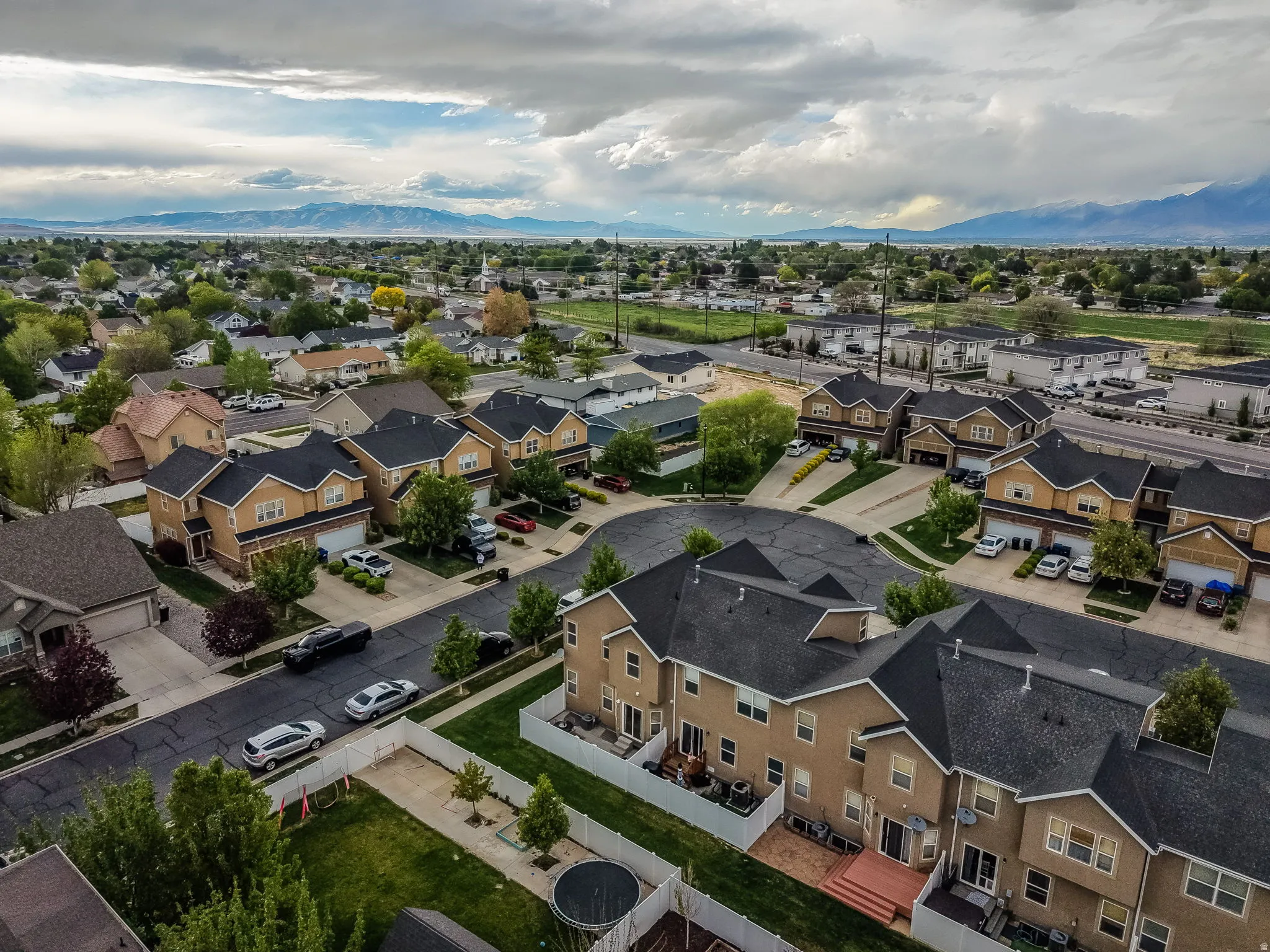 Aerial view of residential area with a mountainous background