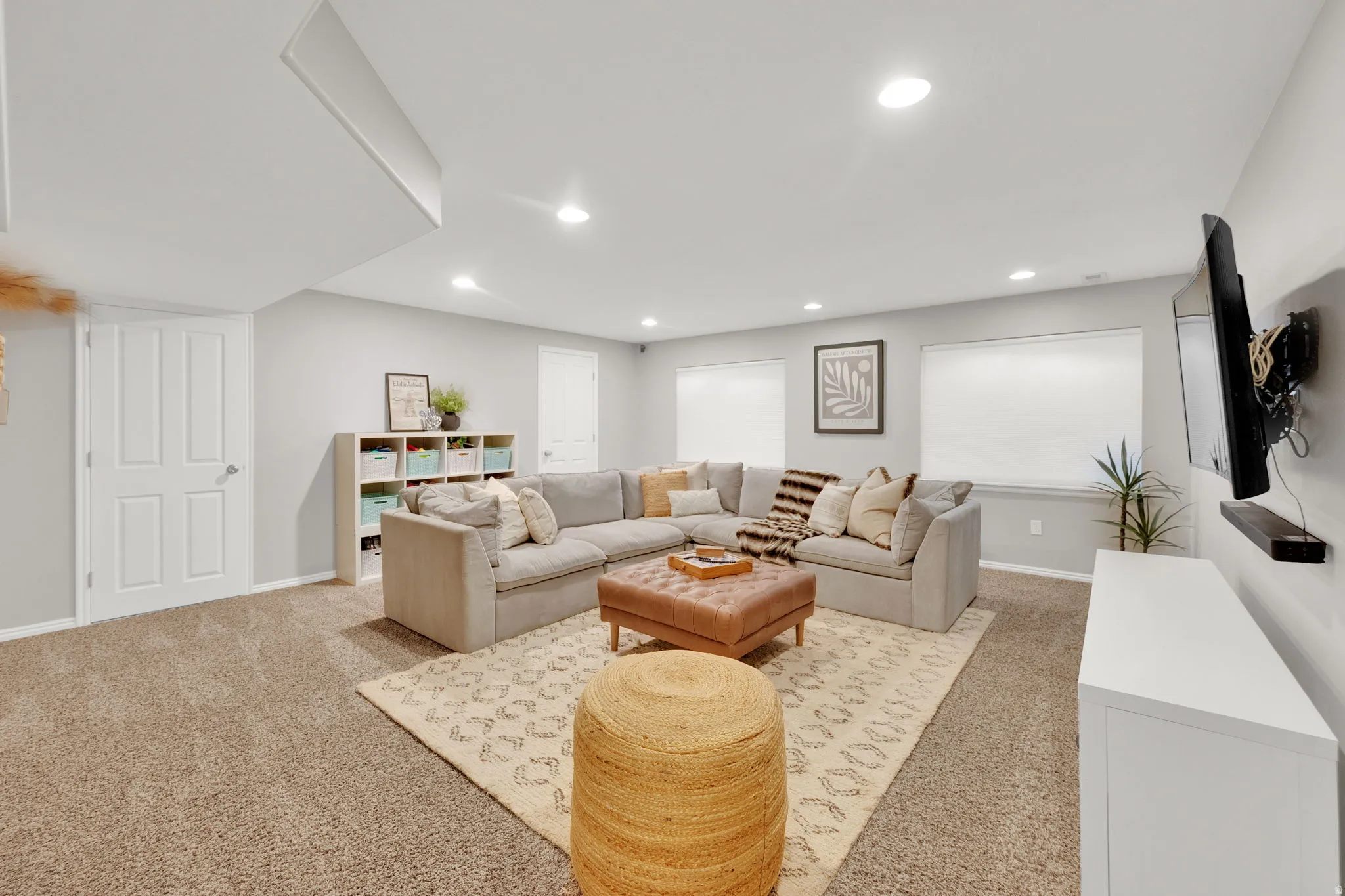 Living room featuring light carpet and recessed lighting