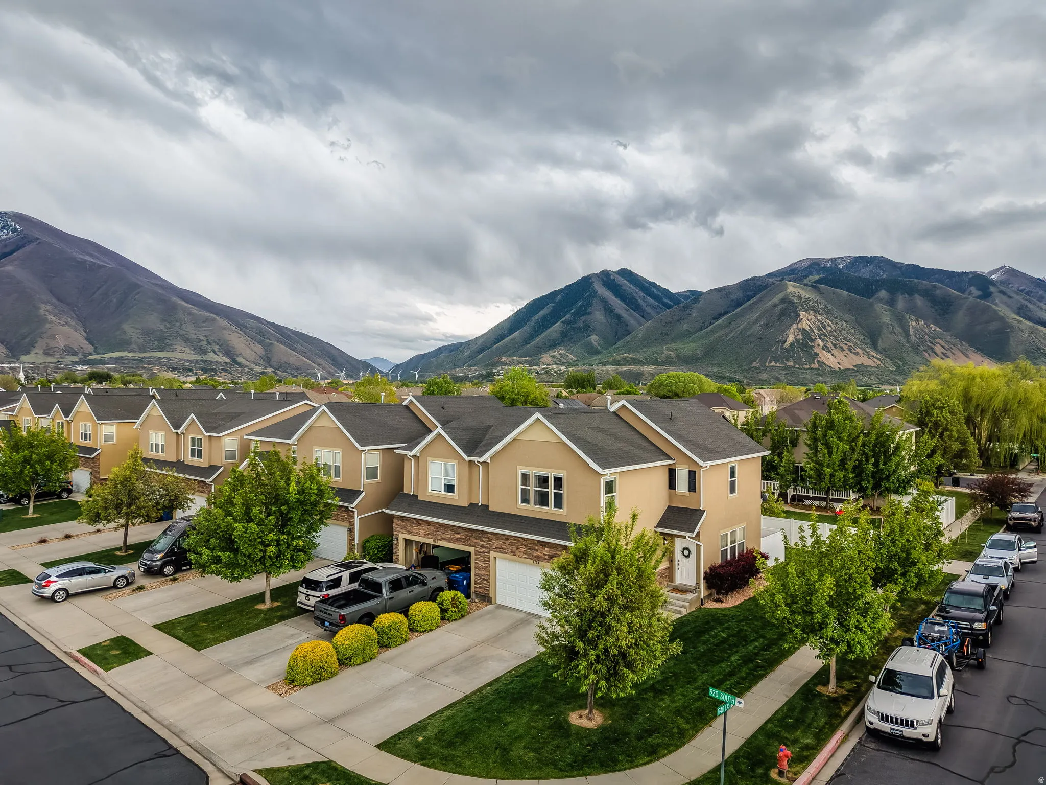 View of mountain backdrop featuring nearby suburban area