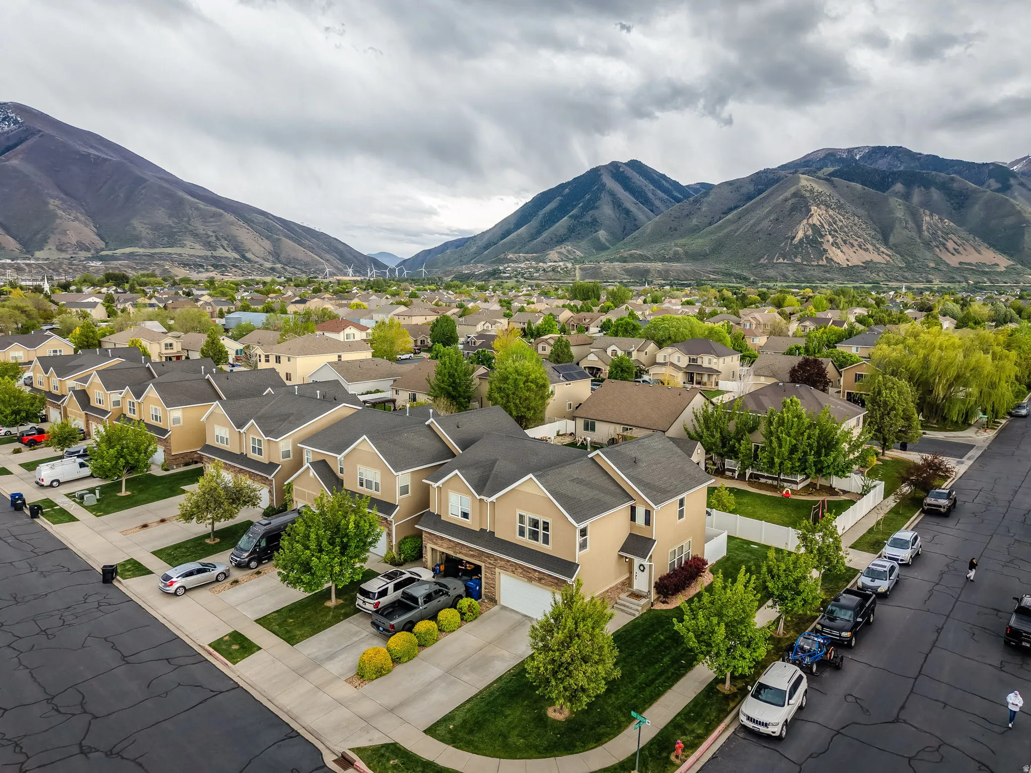 Aerial perspective of suburban area with a mountainous background