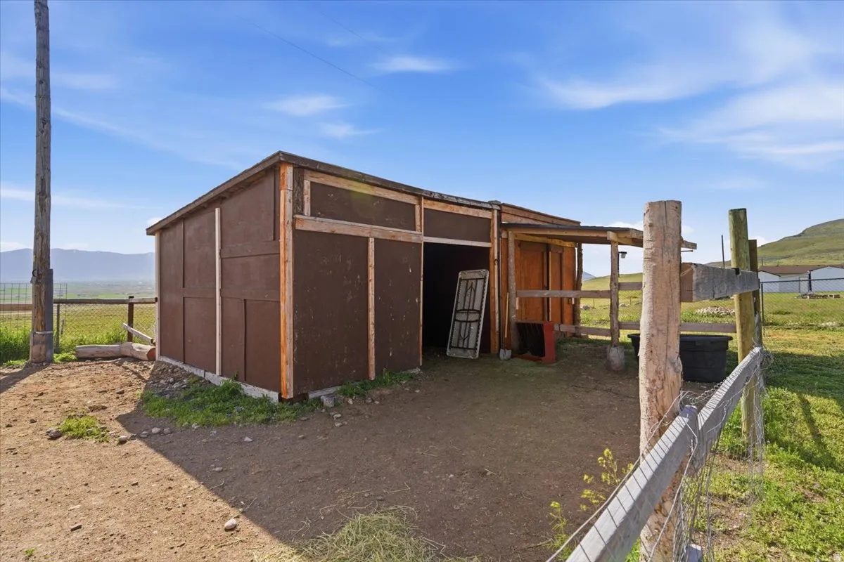 View of outbuilding featuring a mountain view and a view of rural / pastoral area