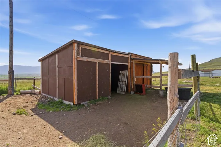 View of outbuilding featuring a mountain view and a view of rural / pastoral area