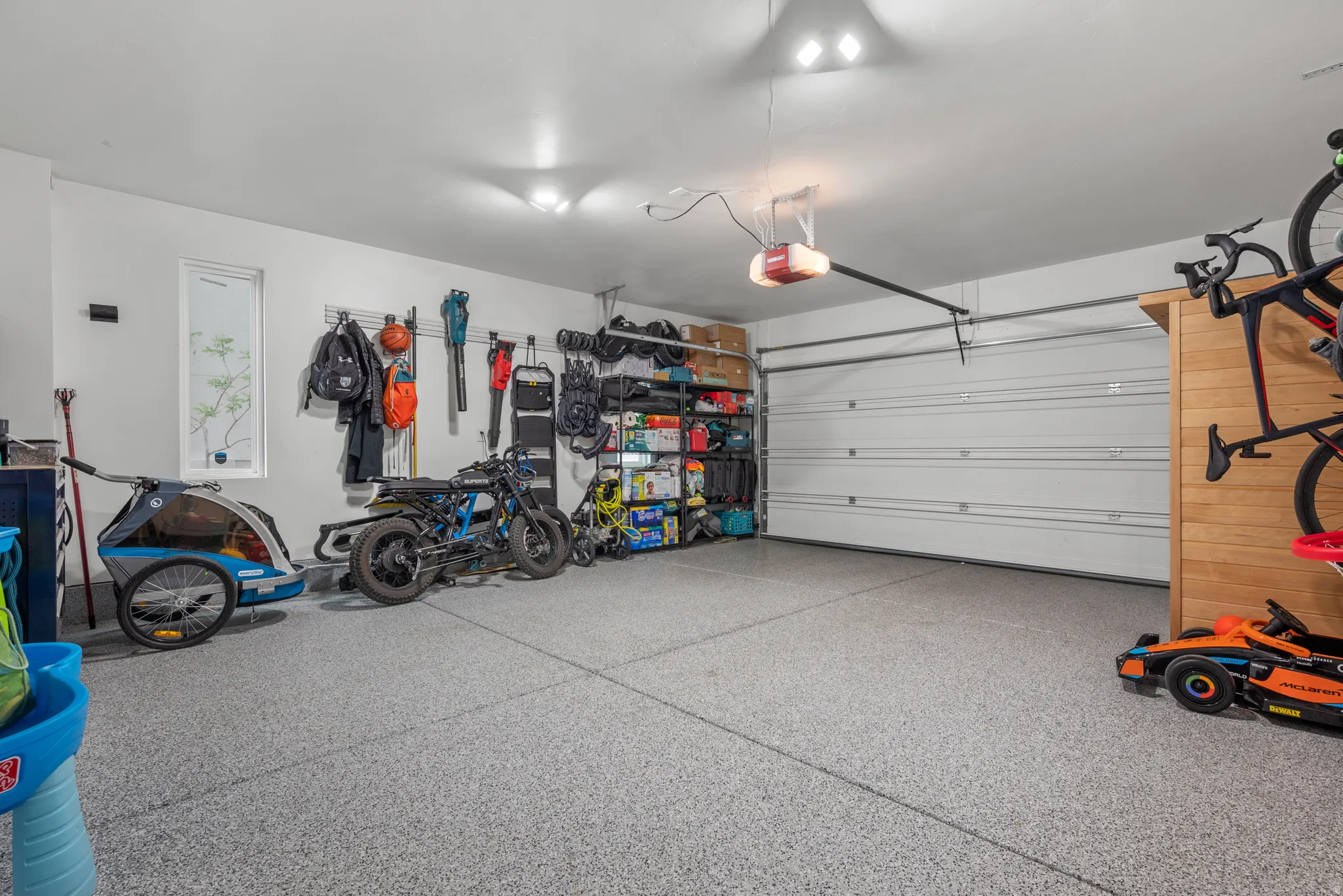Garage featuring a garage door opener