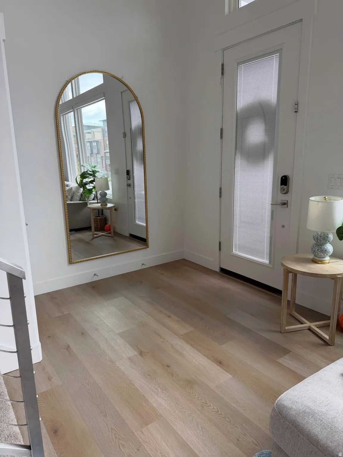 Entryway with light wood-style floors and healthy amount of natural light