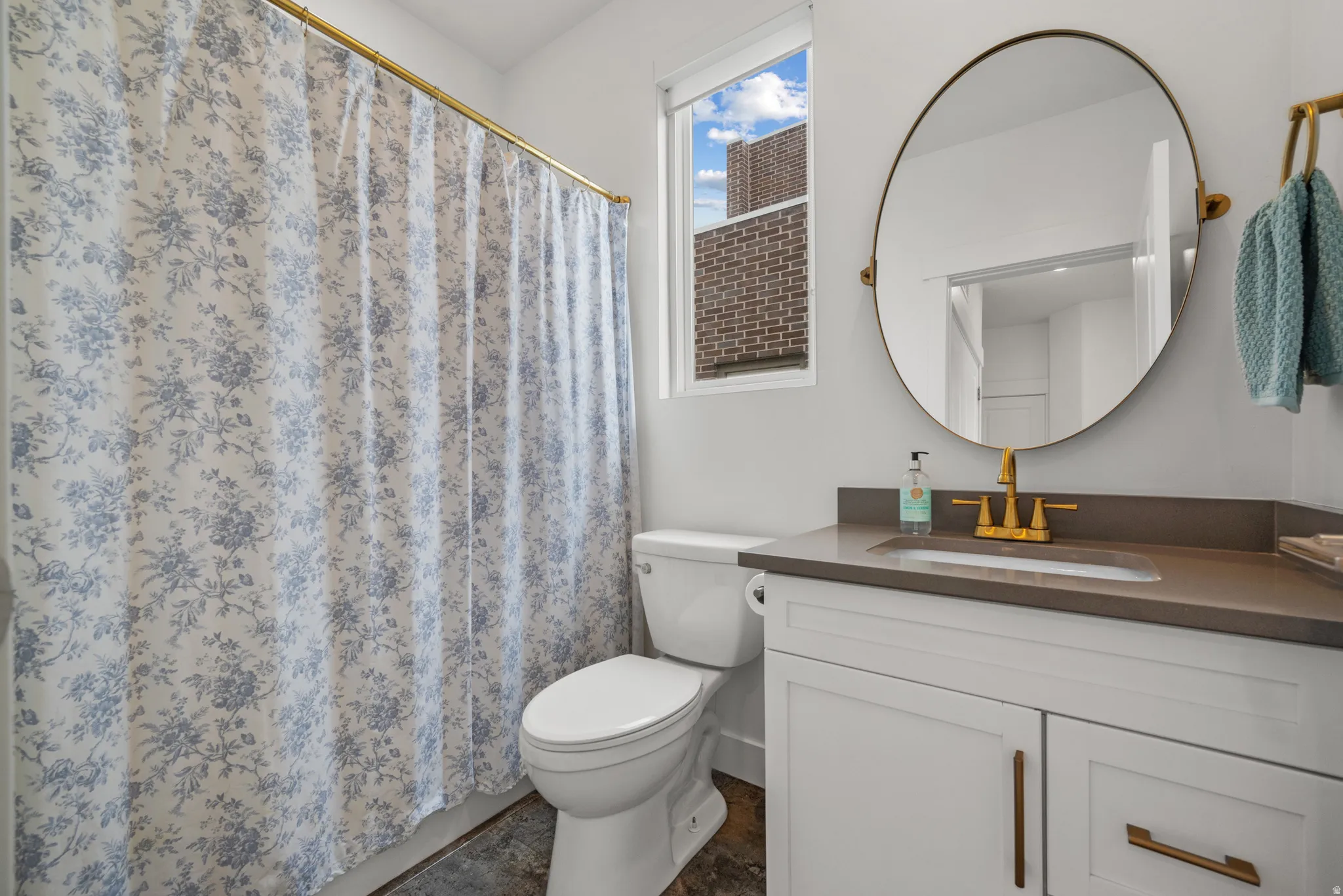 Bathroom featuring vanity and a shower with curtain