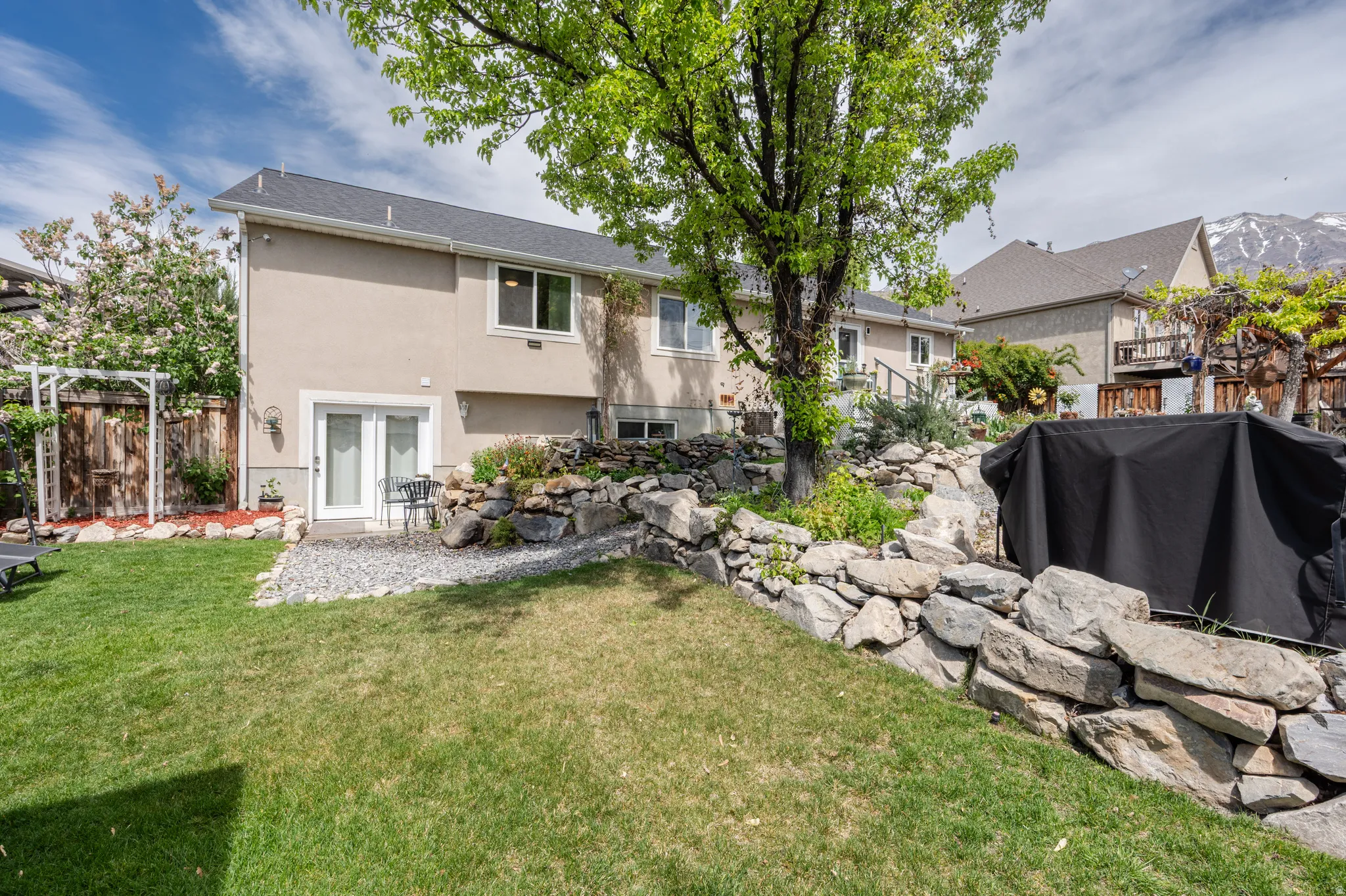 Back of property featuring stucco siding, french doors, and a patio
