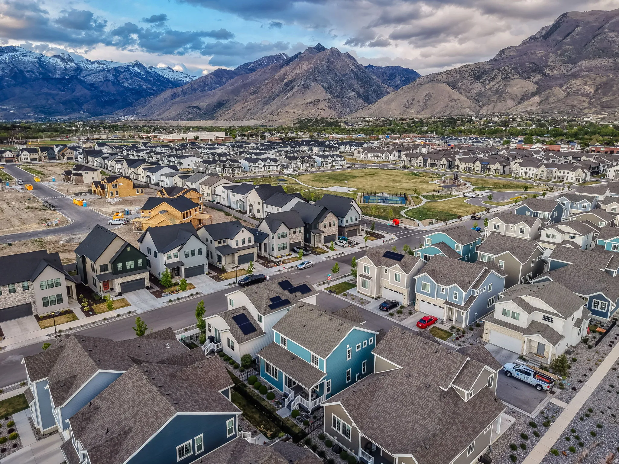 Aerial perspective of suburban area with a mountain backdrop