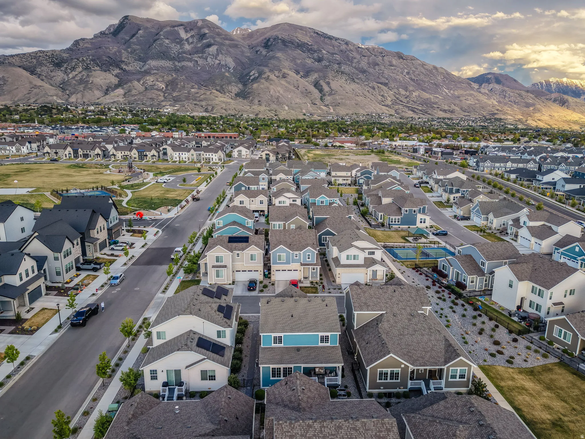 Aerial perspective of suburban area featuring a mountainous background