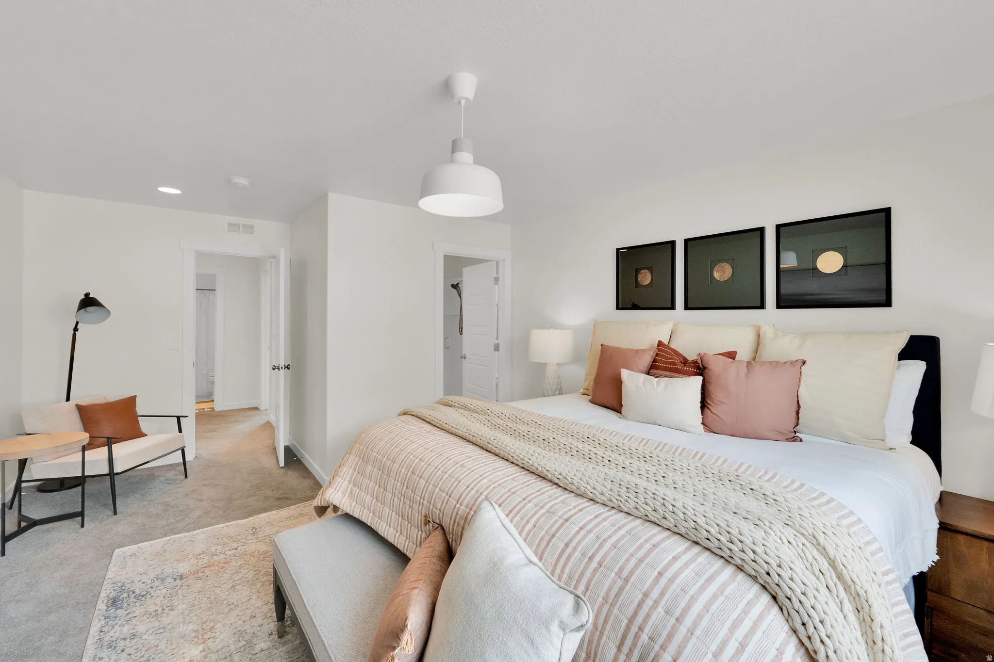 Primary Bedroom with carpet and baseboards and sitting area.
