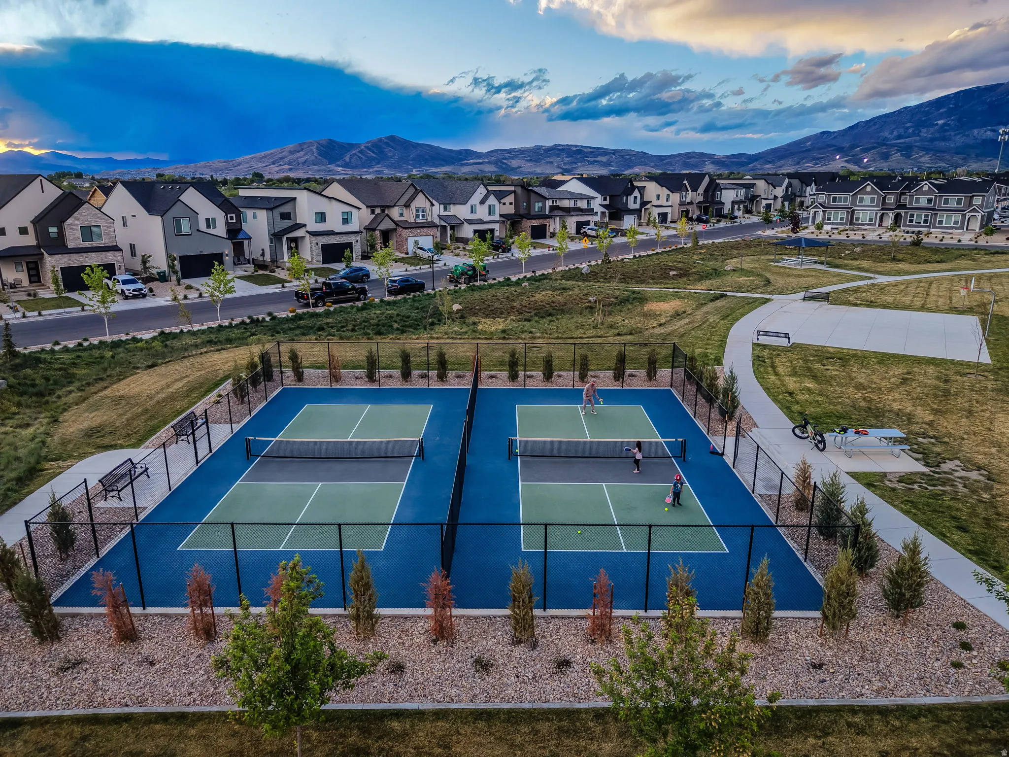 View of pickleball court featuring a mountain view and park trails